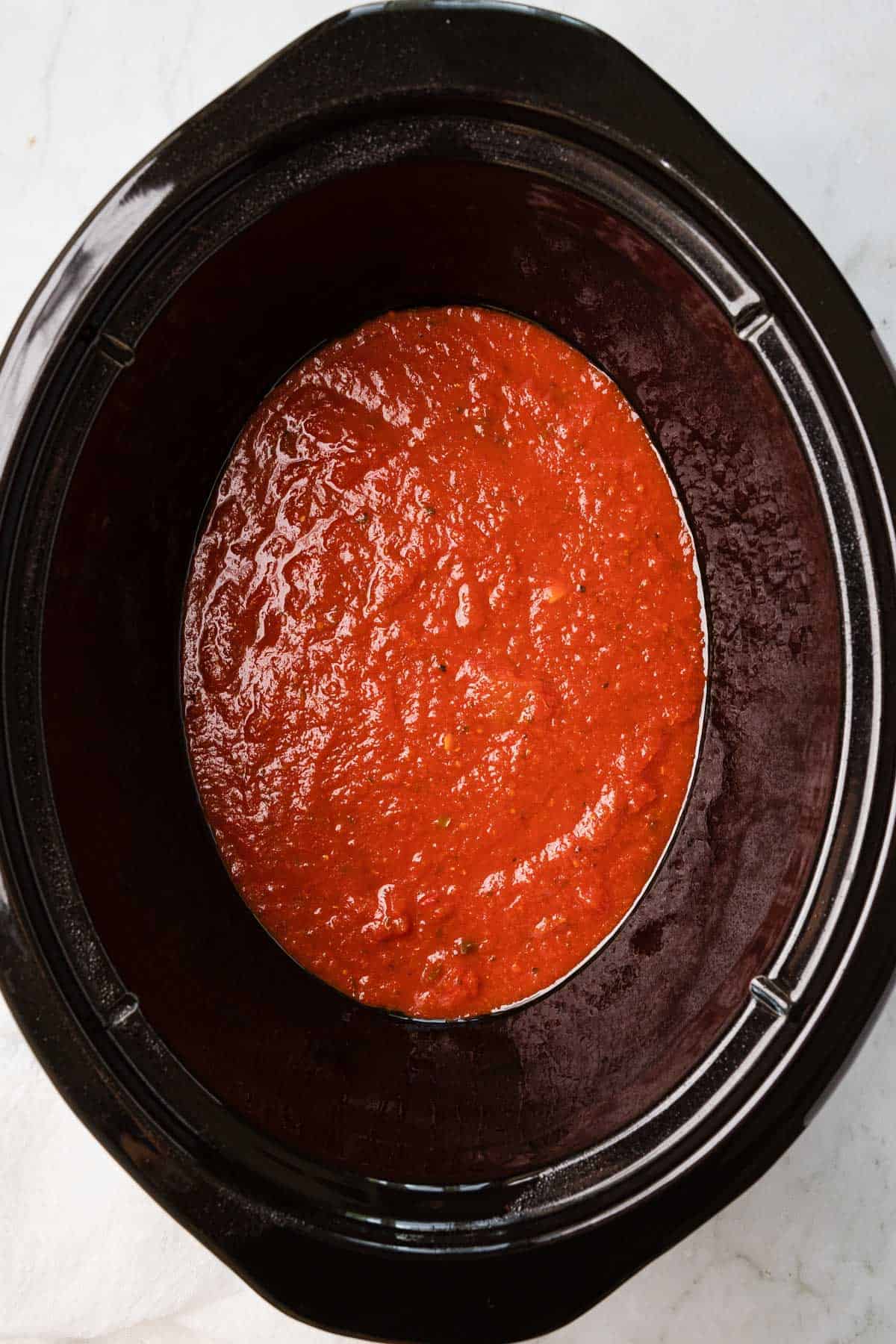 tomato sauce in the bottom of crockpot