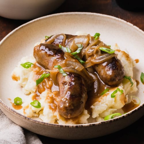 Irish Bangers and Mash with Guinness Onion Gravy - The Travel Palate