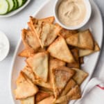 Air fryer pita chips on a plate.