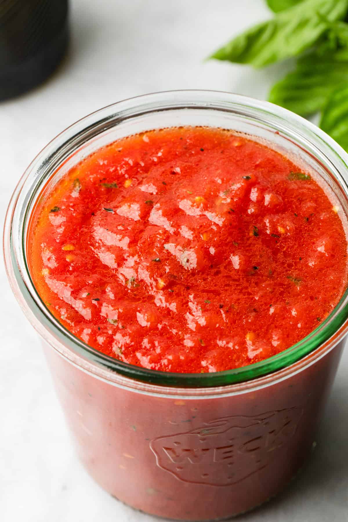 Authentic tomato sauce in a glass container.