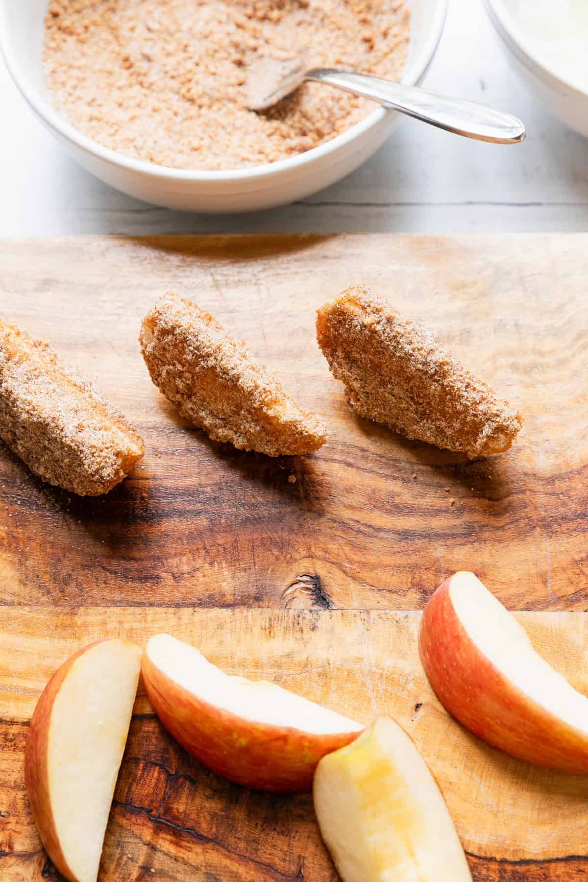 Apple slices with coating on them.