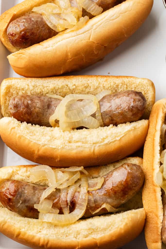 Cooked brats in buns.