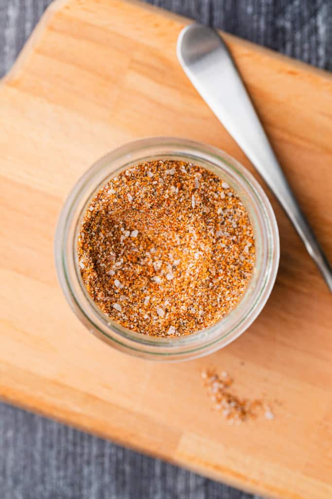 Steak rub seasoning in a glass jar.