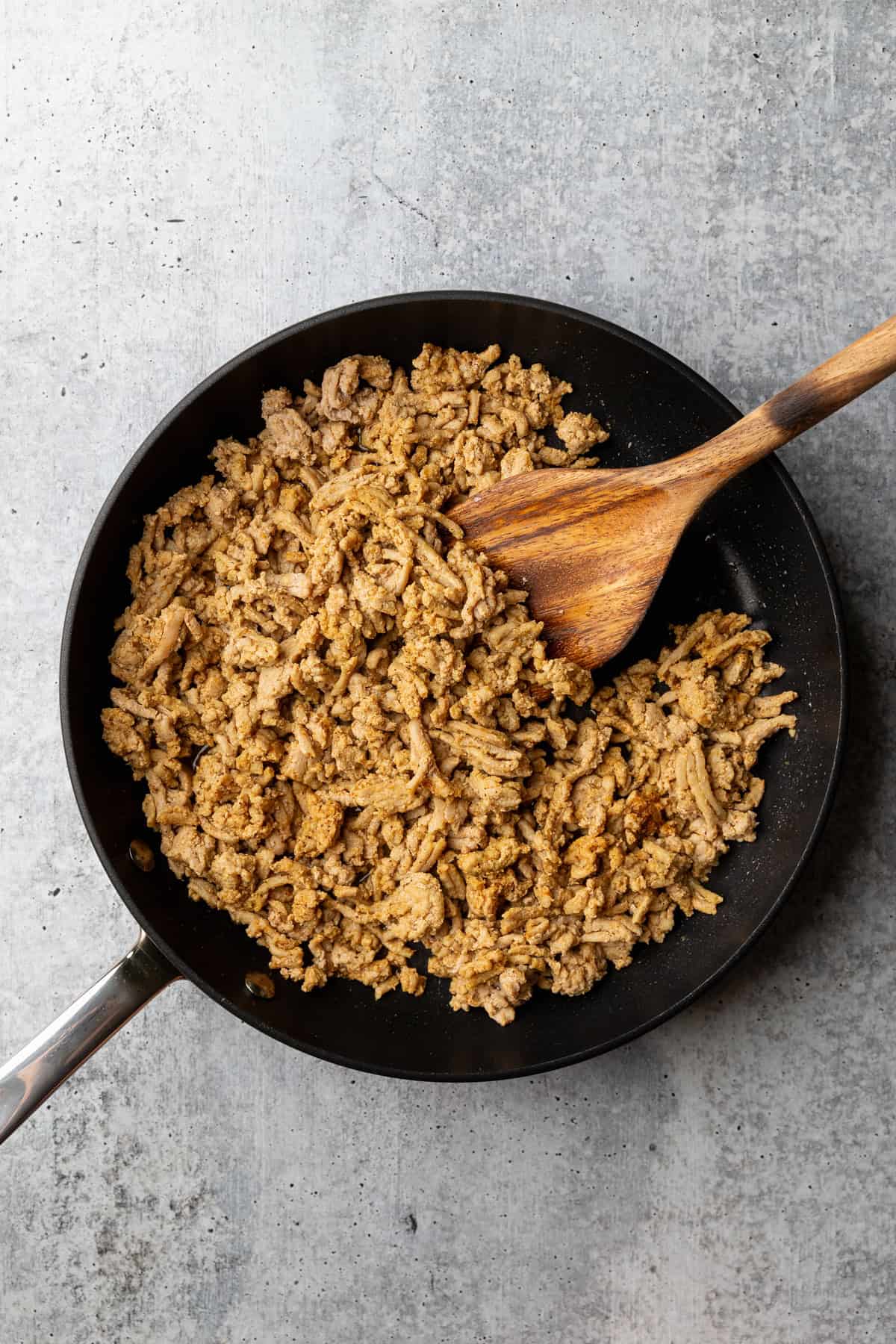 Cook ground turkey in a skillet.