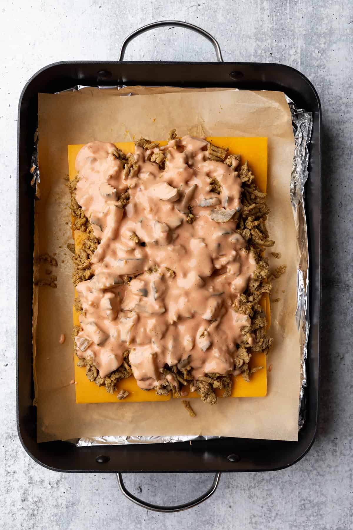 Burger sauce layered on ground turkey.