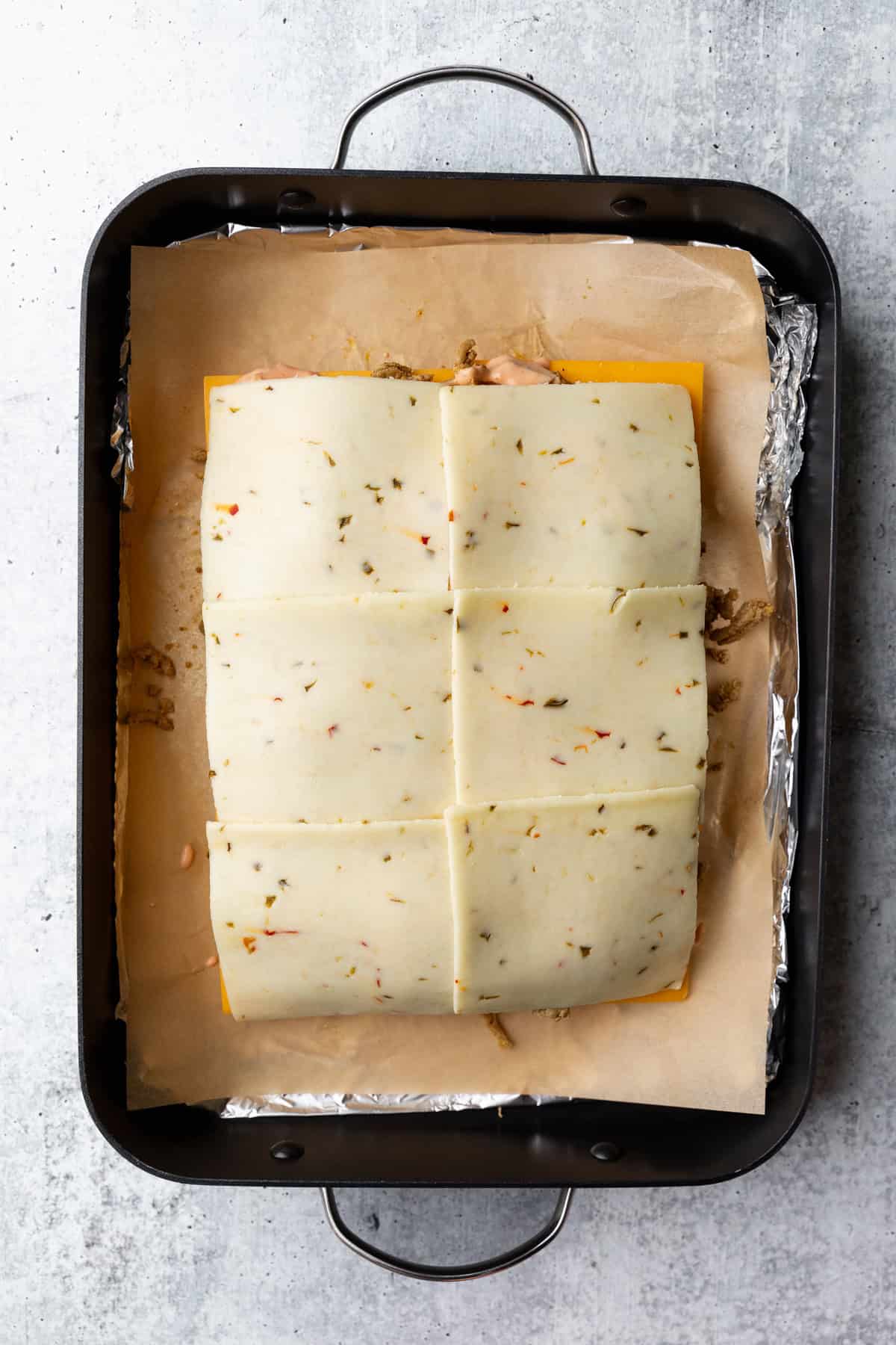 Pepper jack layered on top of burger sauce.