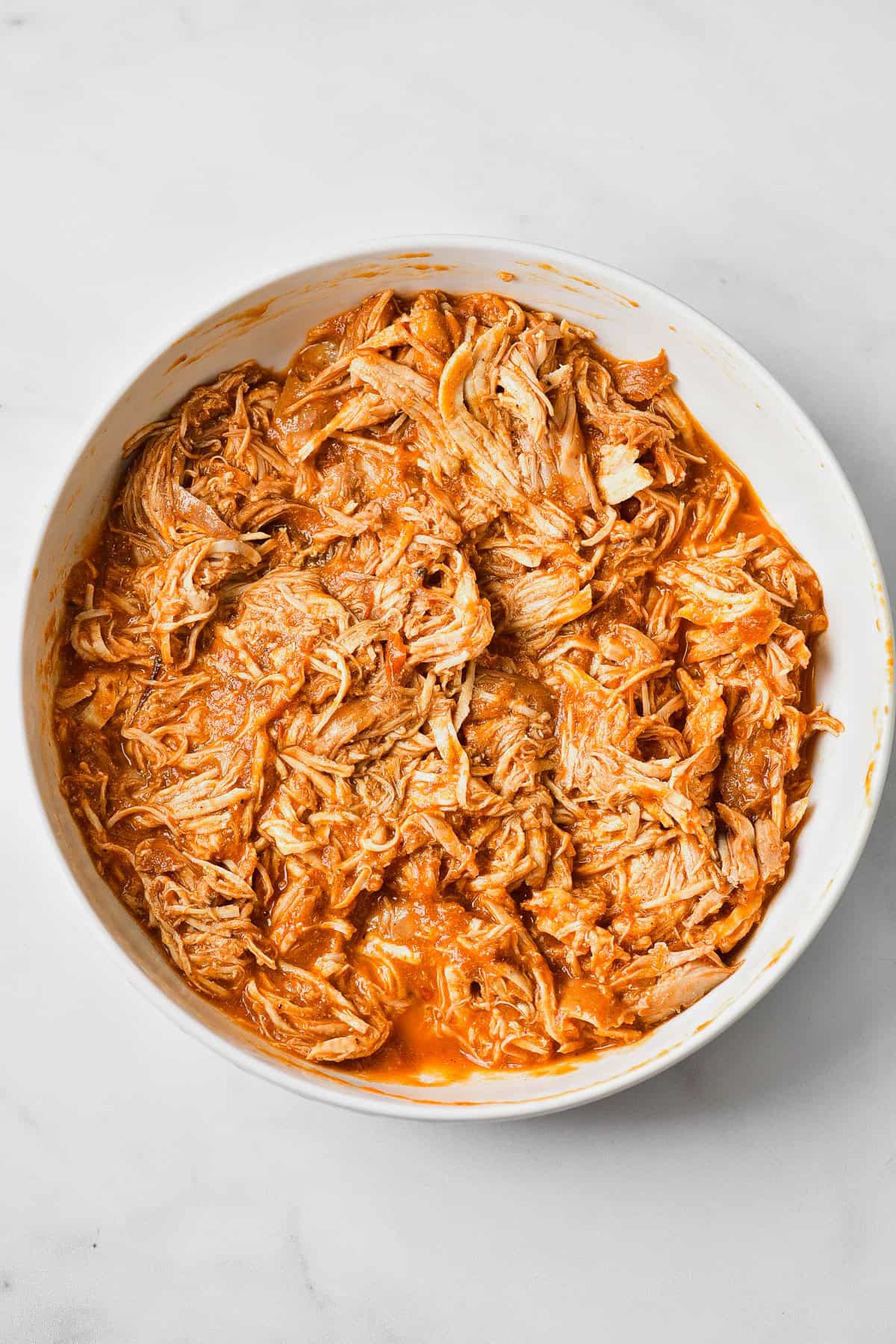 The shredded chicken in the tinga sauce.