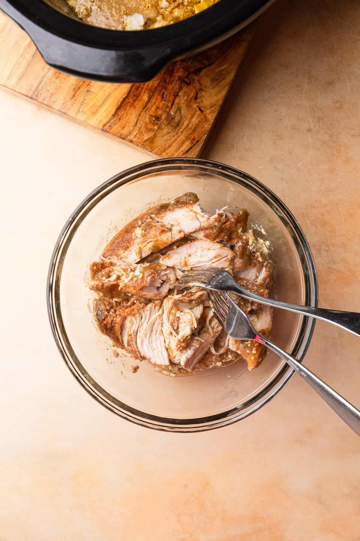 Shredded chicken in a bowl.