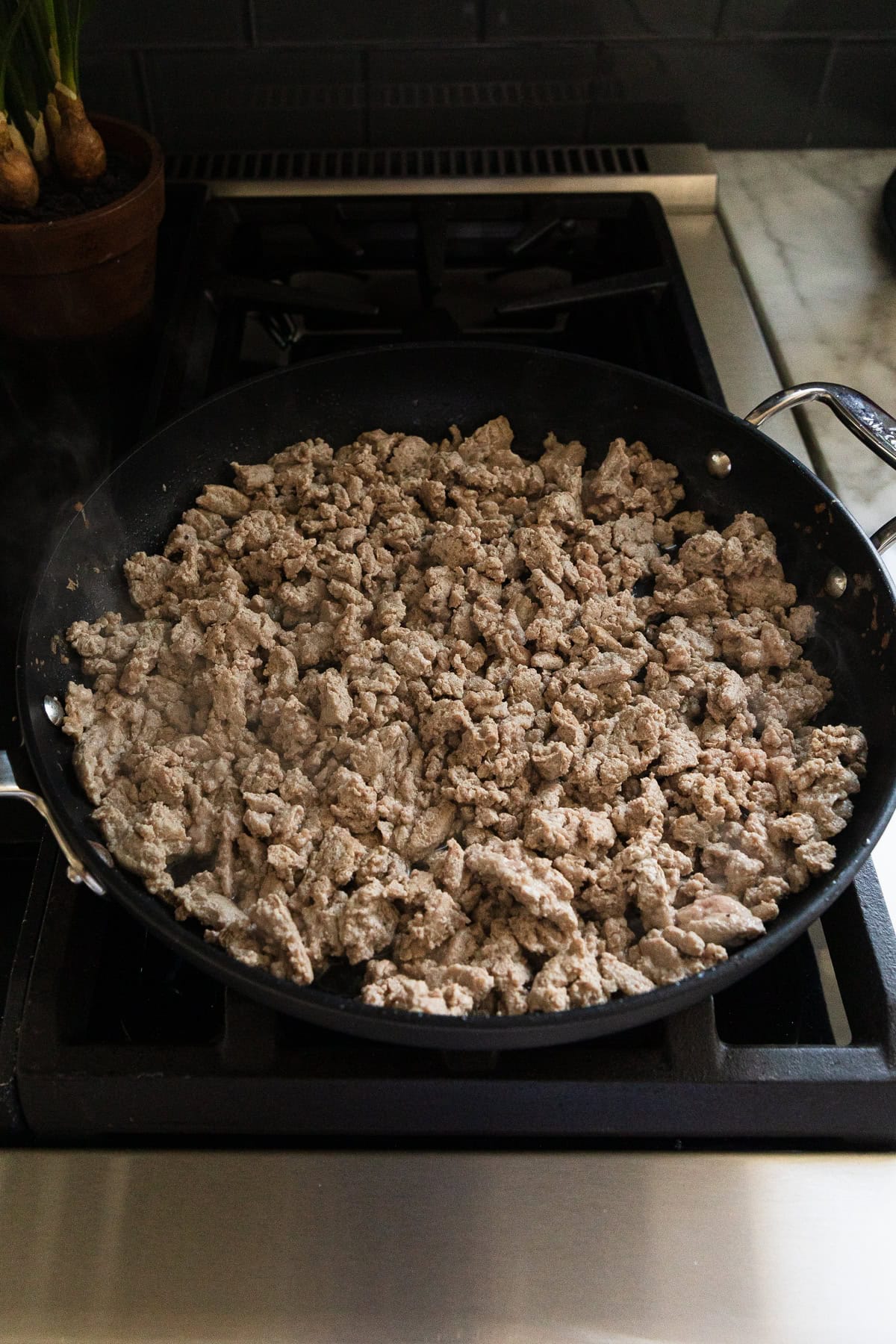 Ground turkey browned in a skillet.