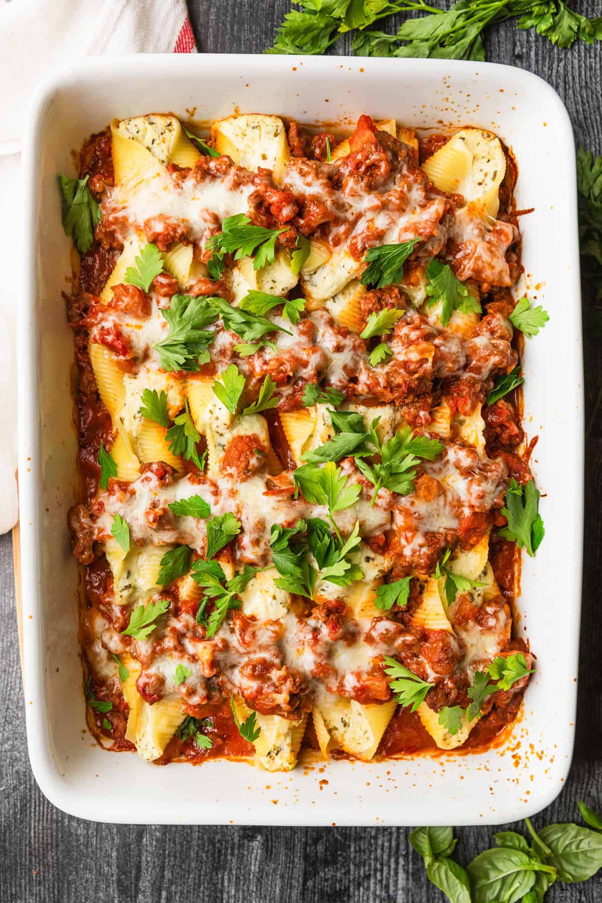 A baking dish filled with stuffed shells.