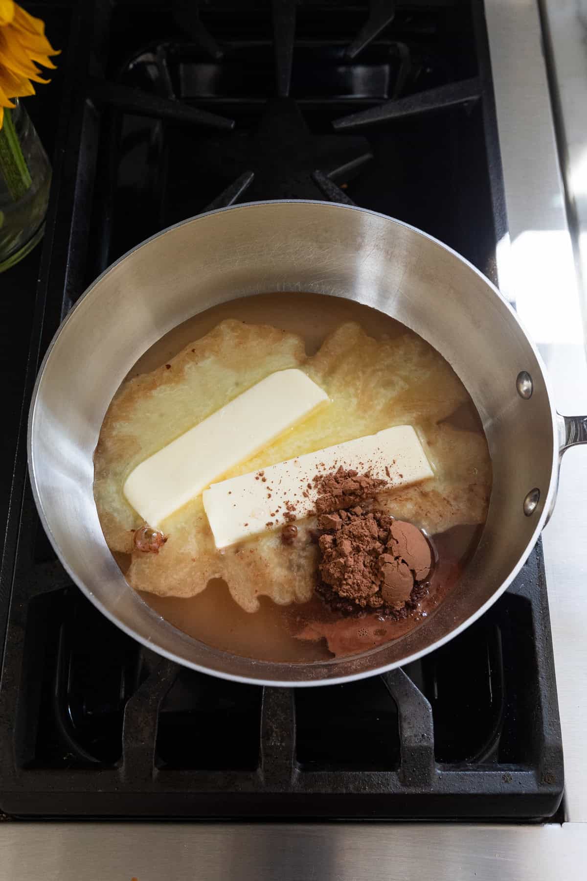 Melted butter and other ingredients in a saucepan.