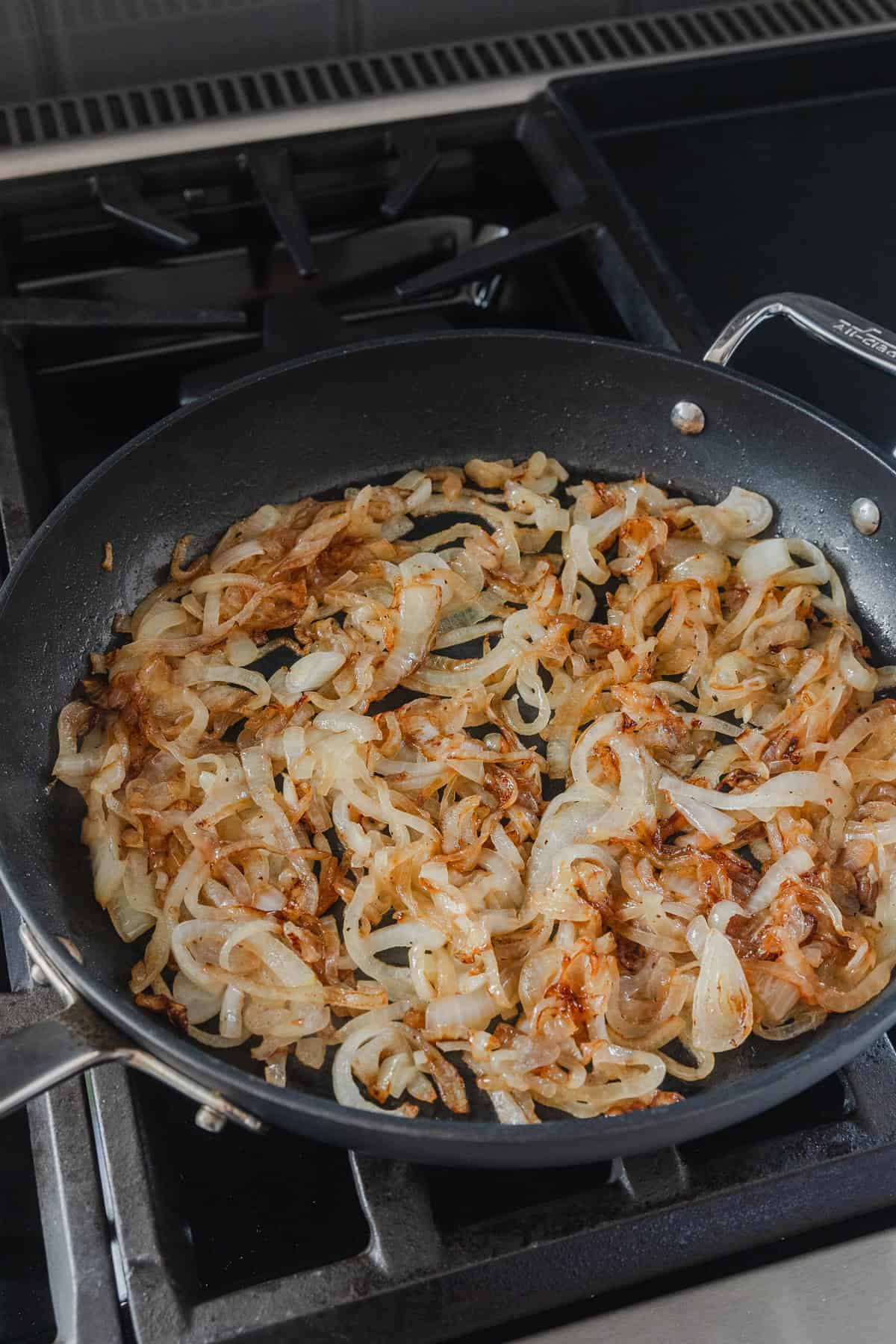 Caramelized onions cooked in a skillet.