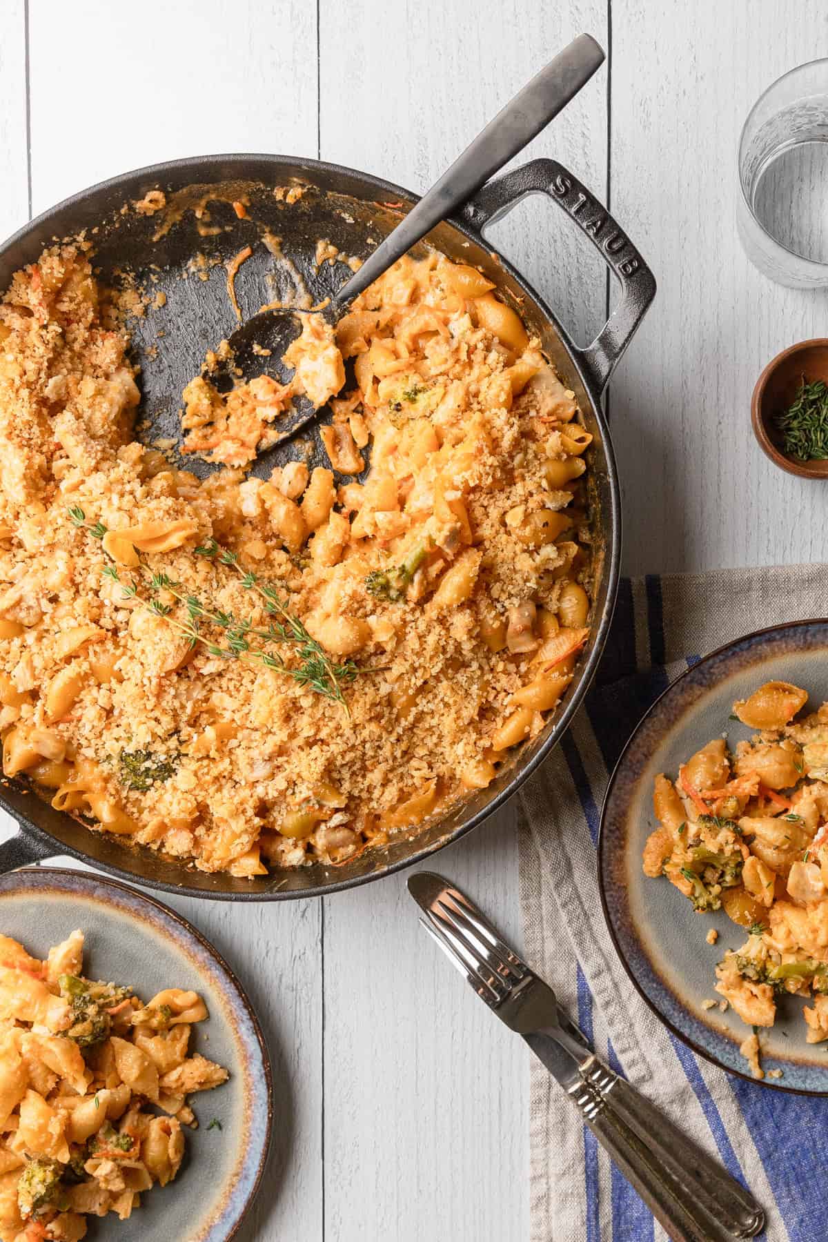 Broccoli chicken cheddar casserole being served from the skillet.