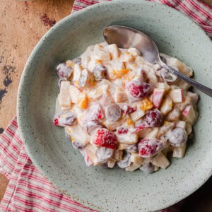 Fruit salad made with condenses milk.