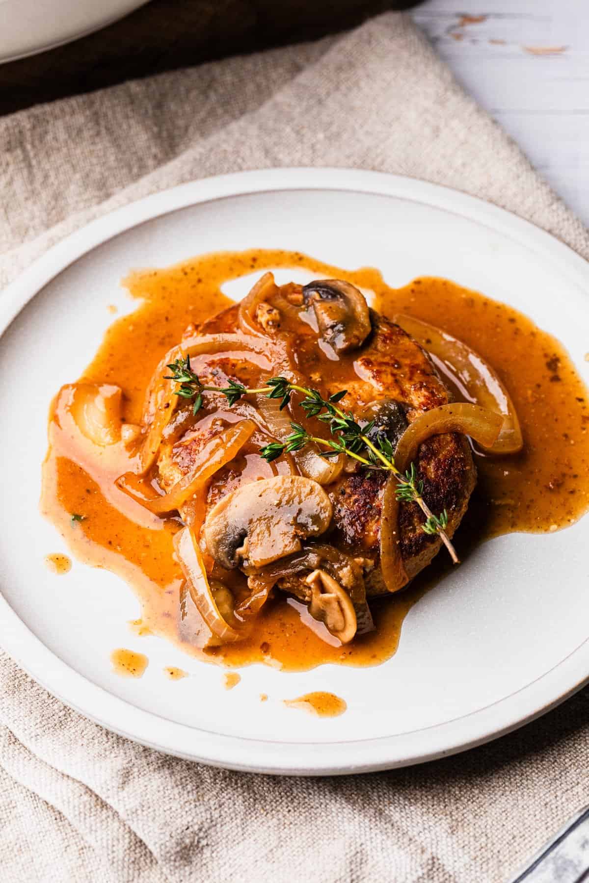 The completed turkey salisbury steak recipe on a plate.