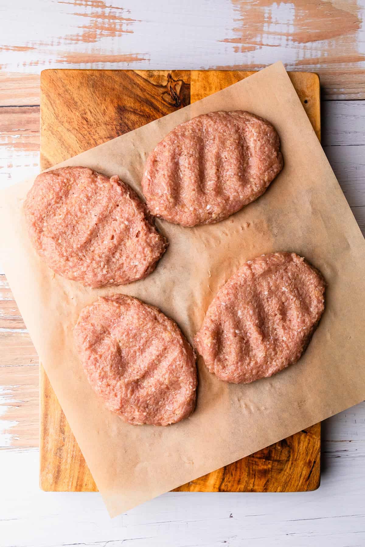 Four ground turkey patties to make salisbury steaks.