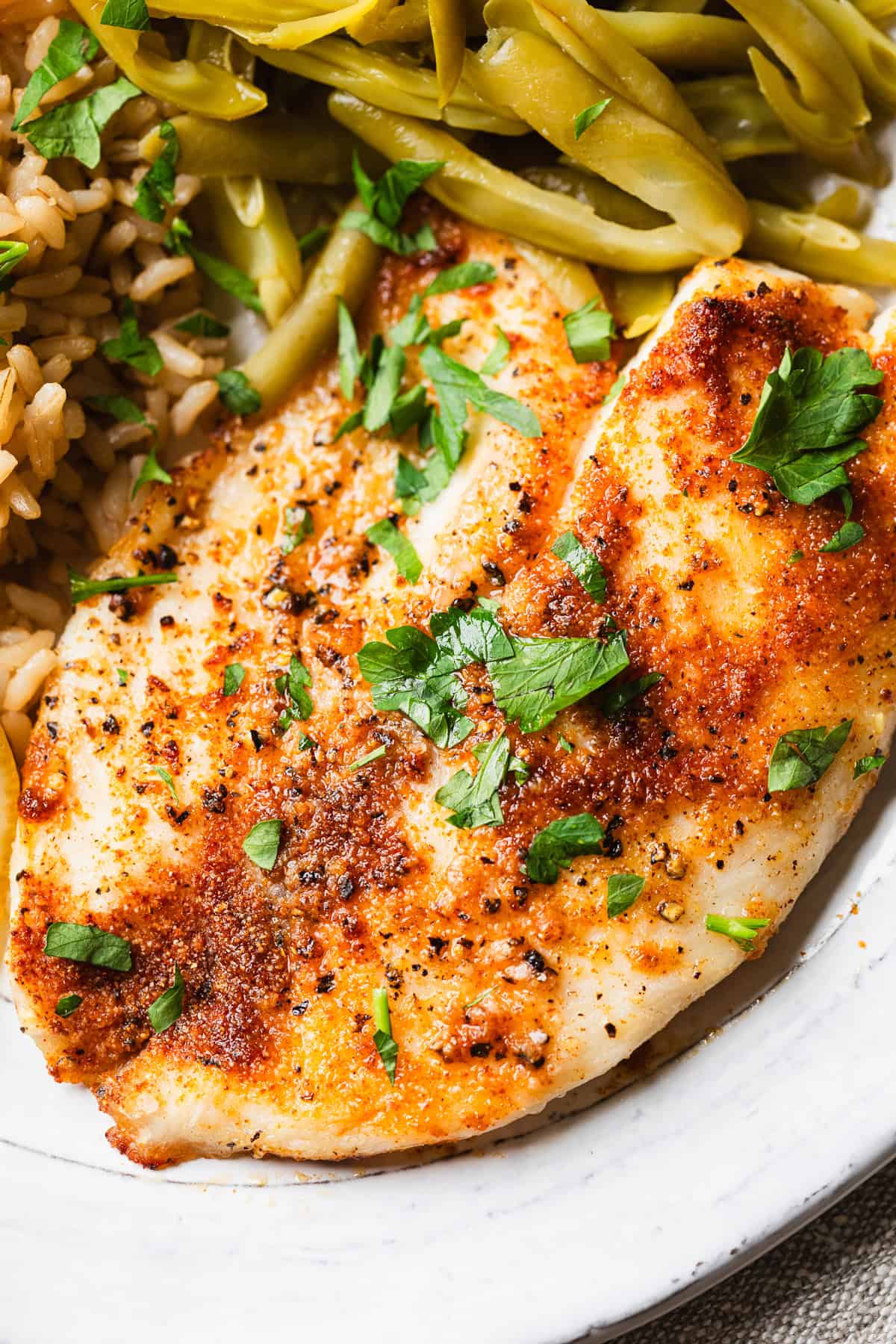 The completed tilapia with green beans on the side.