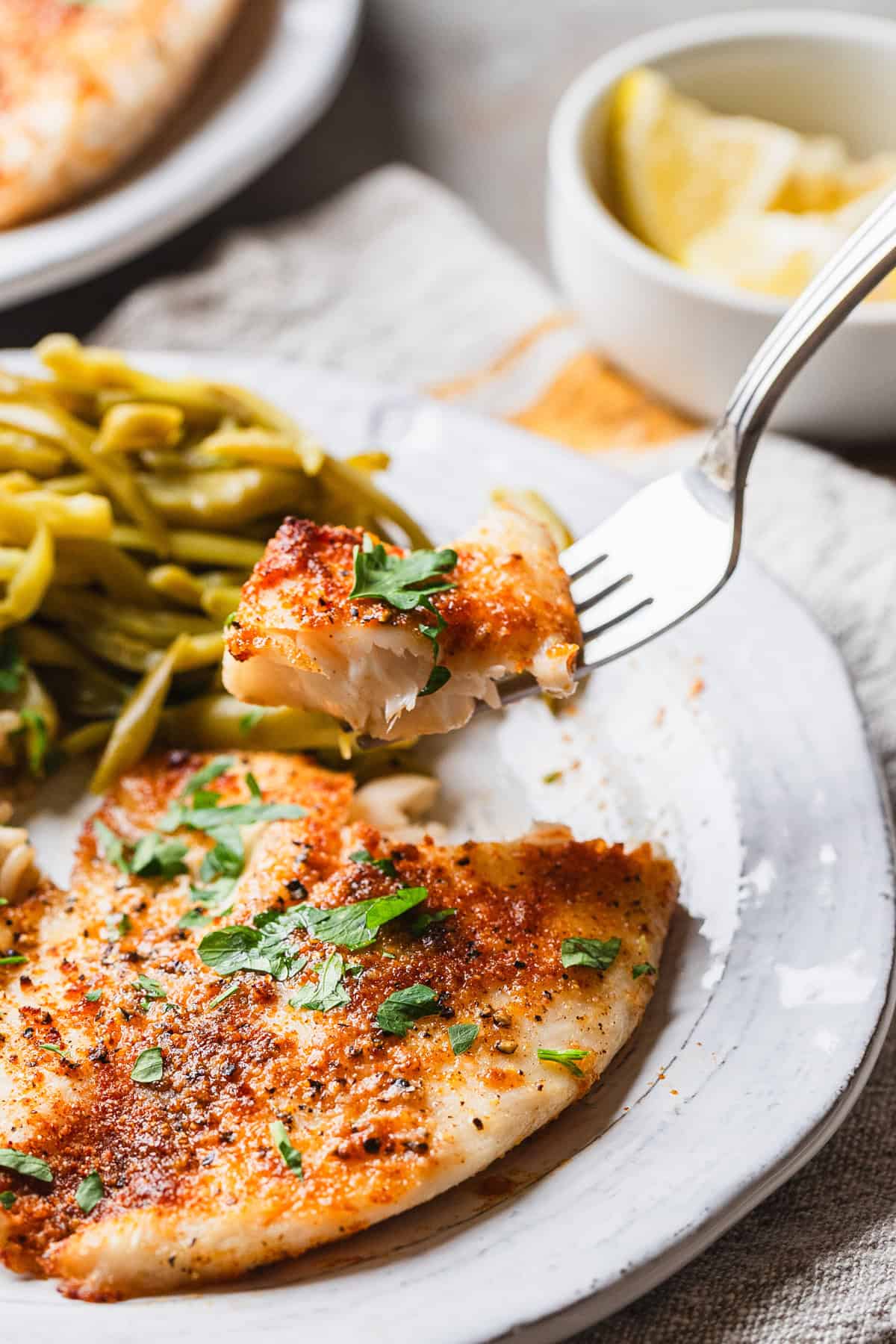 The completed air fryer tilapia recipe on a plate.