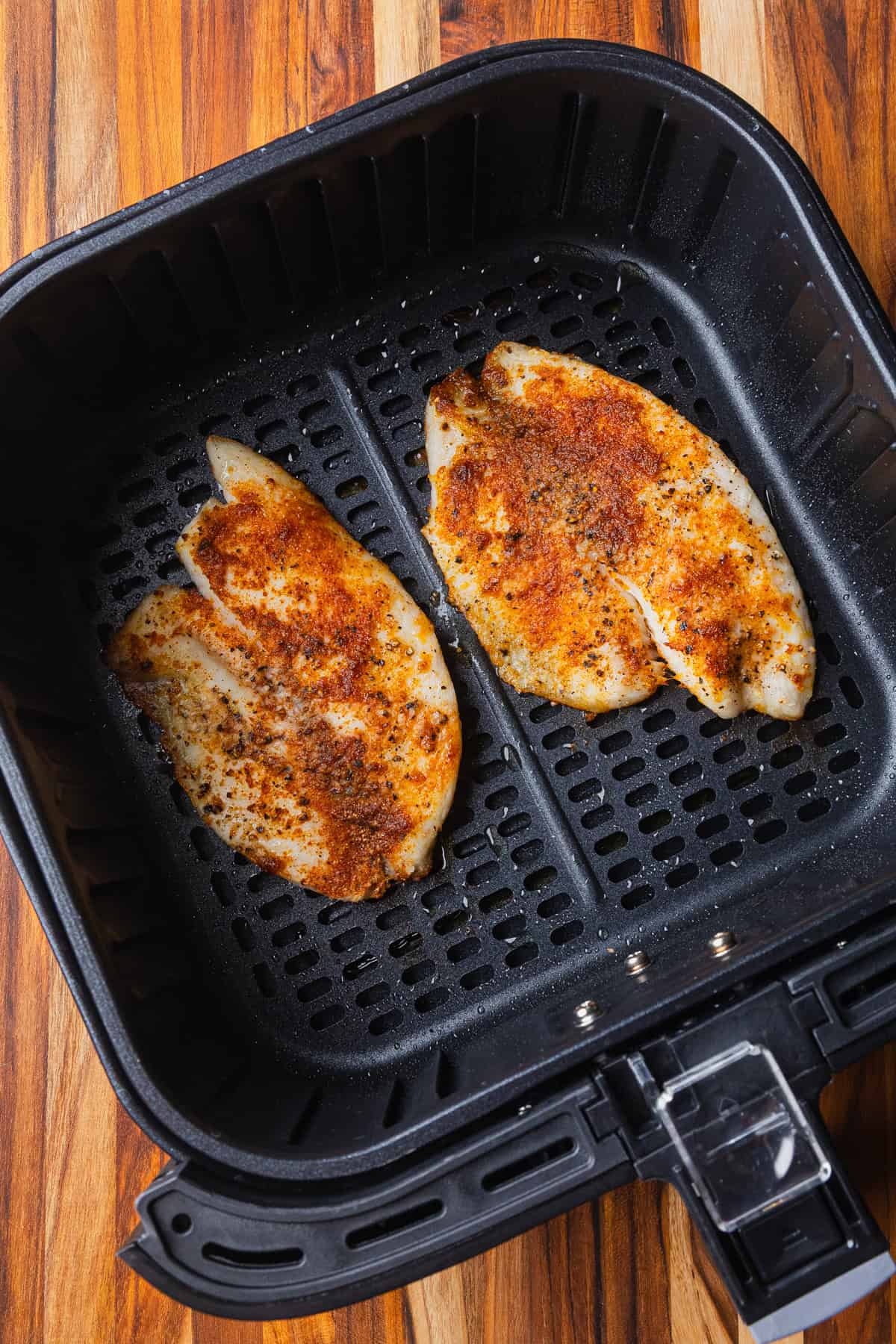 Air fryer tilapia filets cooked.