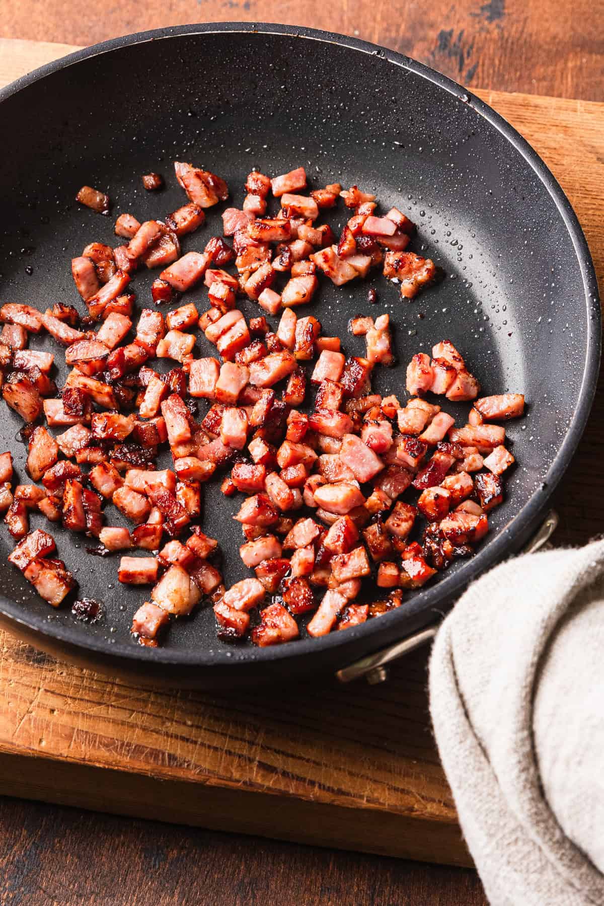 Cooking diced ham until crispy.