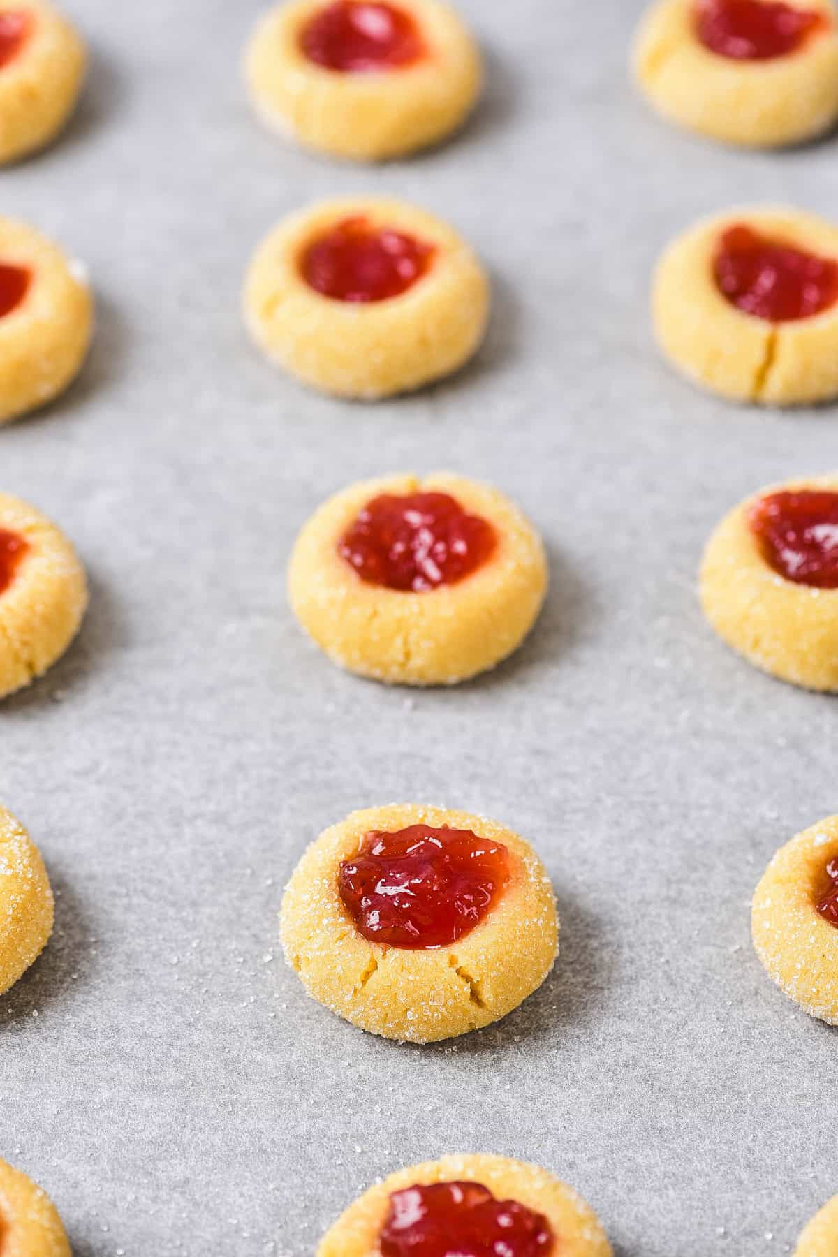 Added jam to center of unbaked cookies.