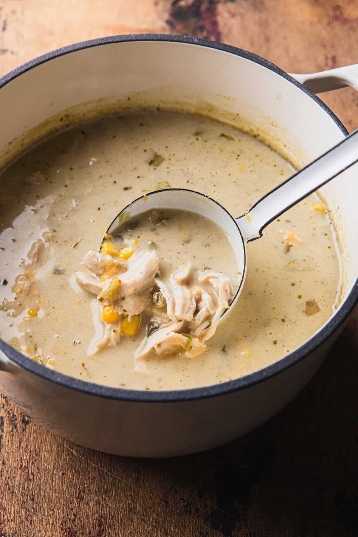 Stirring green chile chicken soup.