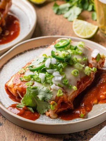 Wet beef burrito recipe completed and served on a plate.