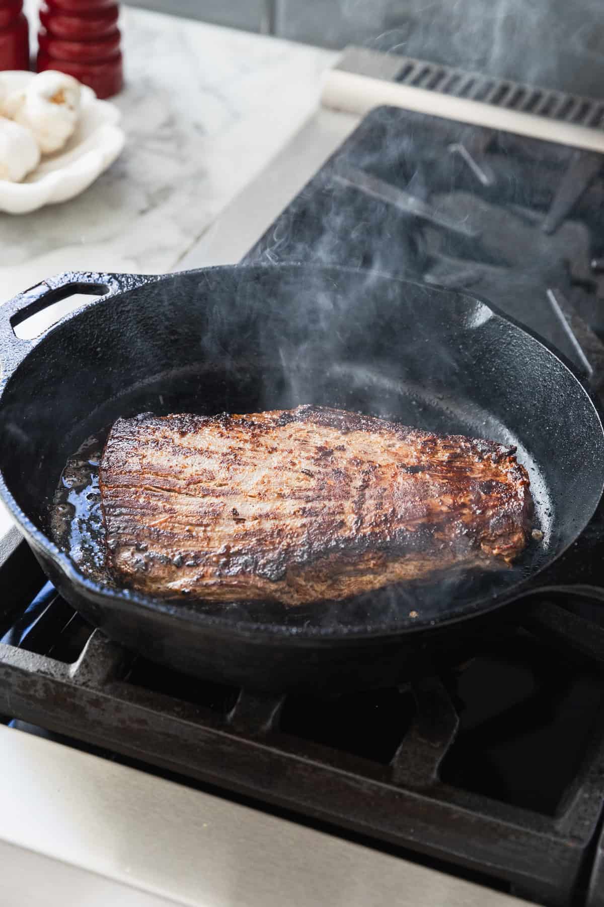 Pan searing flank steak.