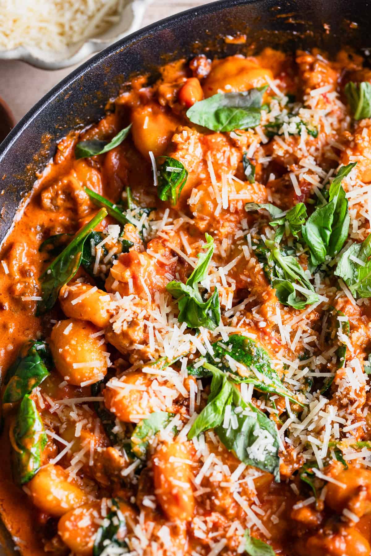 The completed recipe in the pan topped with fresh herbs.