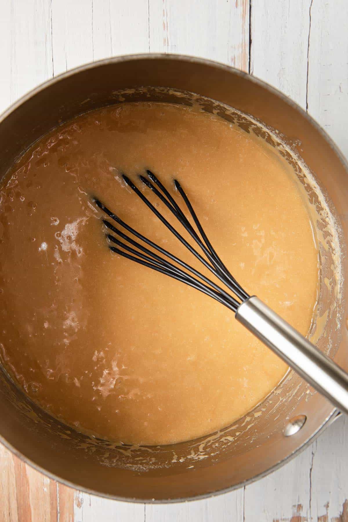 Making the caramel sauce in the pan.