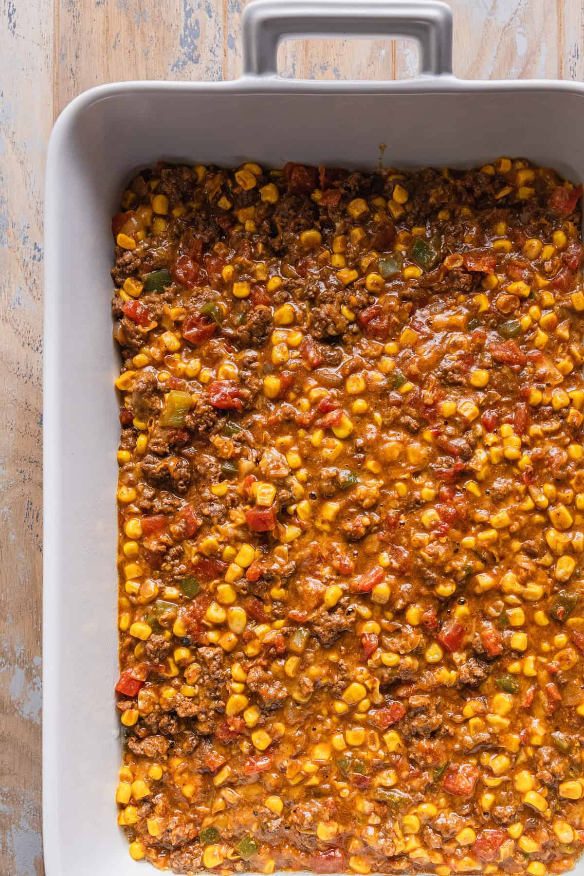 The ground beef mixture in the casserole dish.