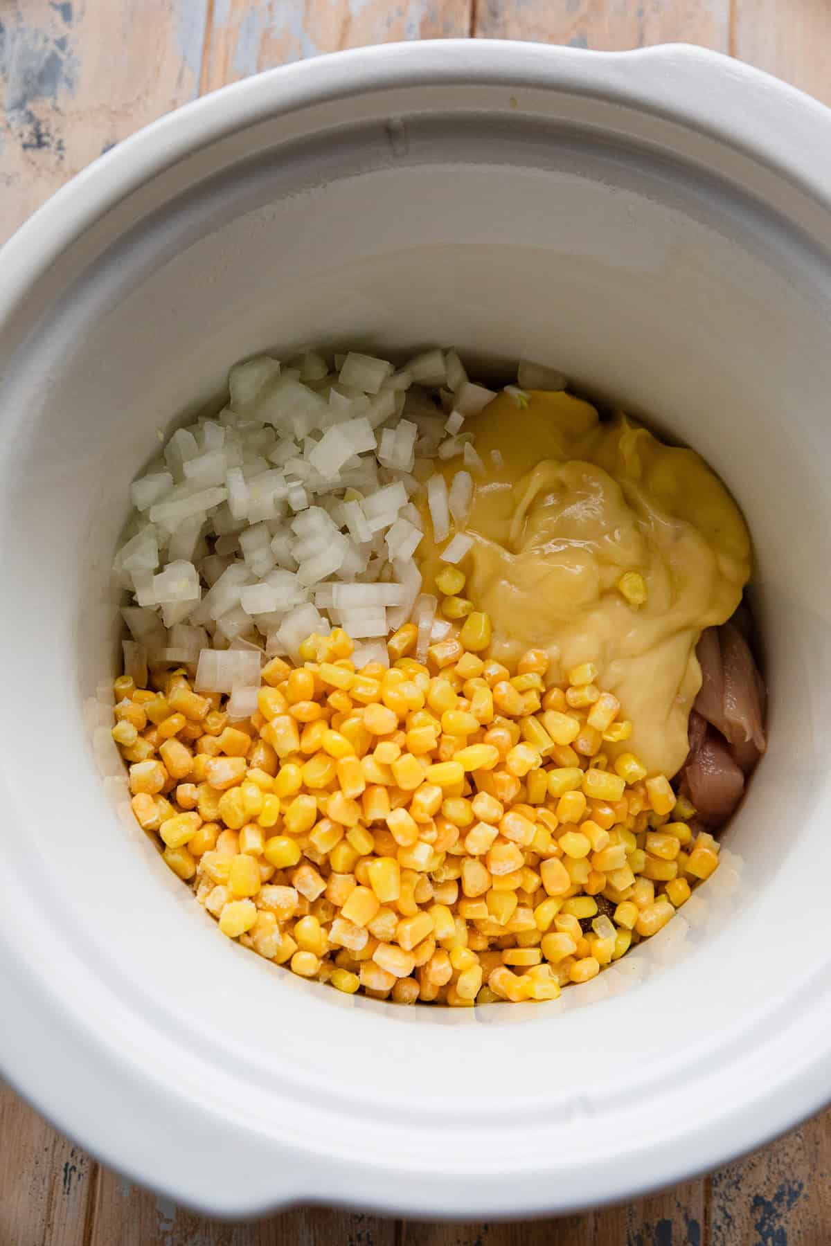 Adding ingredients to the crockpot.