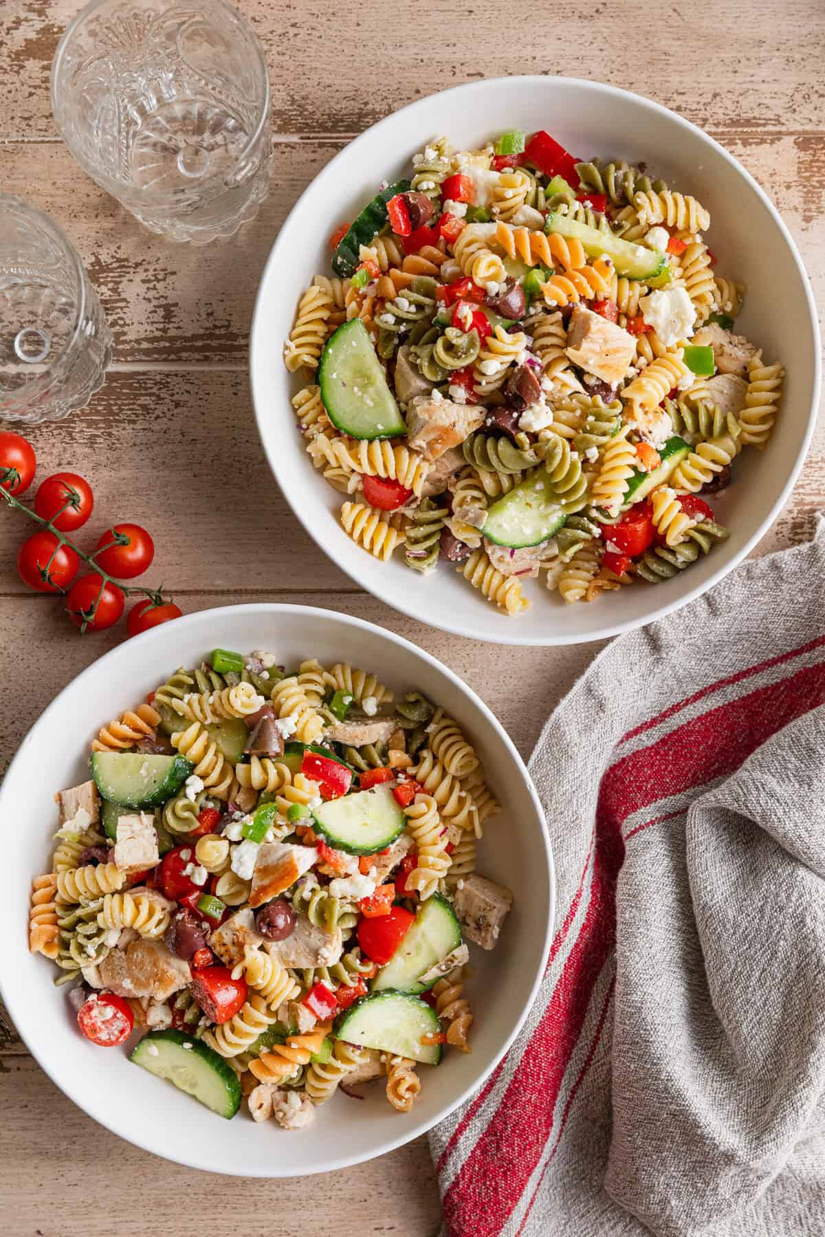 Two bowls of Greek chicken pasta salad.